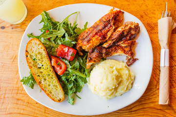 Healthy grilled chicken meal with salad