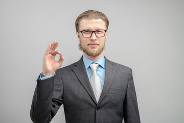 portrait man businessman showing gesture OK