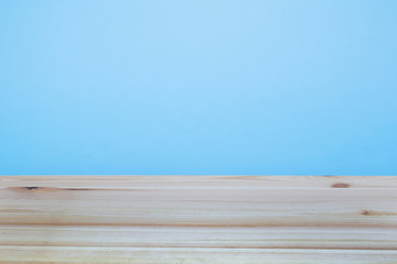 light wood table in the blue wall room. background for ads