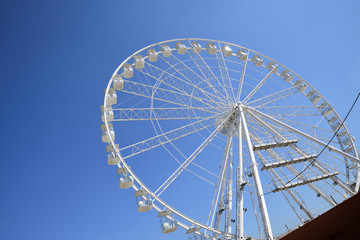 white Ferris wheel on the blue sky