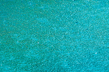 The pool creates an abstract surface in the rain
