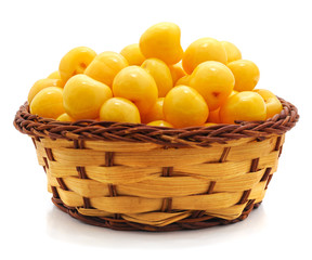 Yellow sweet cherries in a basket.