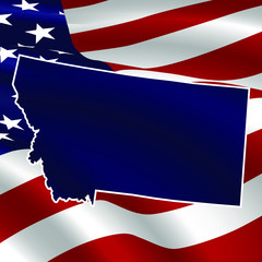 United States, Montana. Dark blue silhouette of the state on its borders on the background of the USA flag.