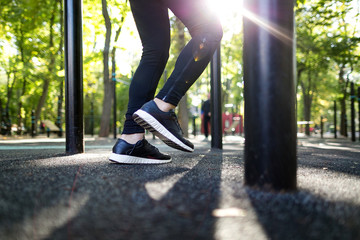 Fototapeta premium Crop feet of sportsman on sports ground