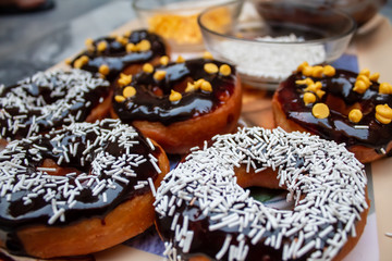 Chocolate donuts with white Sprinkles
