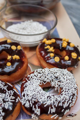Chocolate donuts with white Sprinkles
