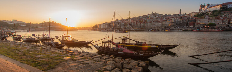 Panoramic of Porto cityscape in sunset with river on the front and wine carrier ship in  foreground and city of Porto in background, Portugal - 346638444