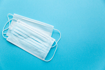 White and blue mask on a blue background on the left.the view from the top
