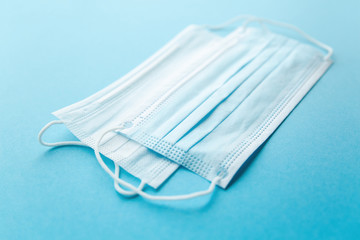 White and blue mask close-up on a blue background
