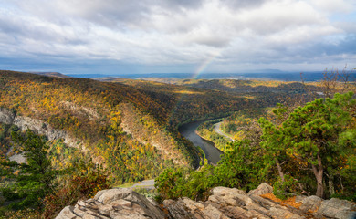 Fototapeta na wymiar Rainbow over Delaware Water Gap and Mount Minsi from Mount Tammany in Autumn - Worthington State Forest