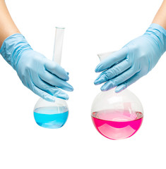 Female hands in a blue rubber glove holds a flask of red blue medicine on white background isolate.
