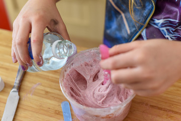 Kids have fun learning at home making slime in a creative science experiment