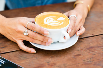 woman hands with cup of coffee
