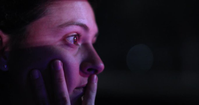 Profile of female driver driving at night. concentrated pensive woman driving