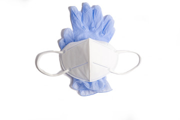 on a white background - medical gloves of blue color, and on top - a protective mask of white color, horizontal position