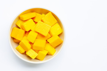 Tropical fruit, Mango cube slices in white bowl on white background.