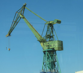 Fototapeta na wymiar green crane with lifting hook