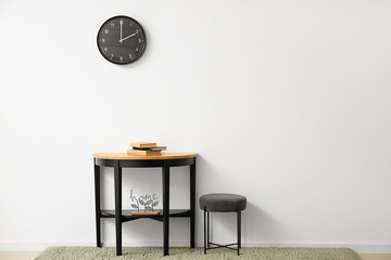 Interior of modern room with stylish table and stool
