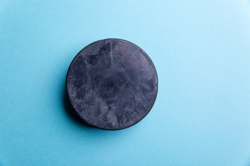 Hockey puck on a blue background
