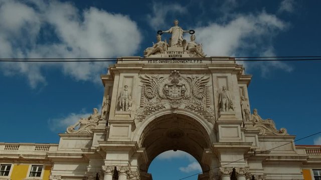 Dramatic shot of the Rua Augusta Arch in Lisbon, Portugal. The stone, triumphal arch-like building dates back to 1873