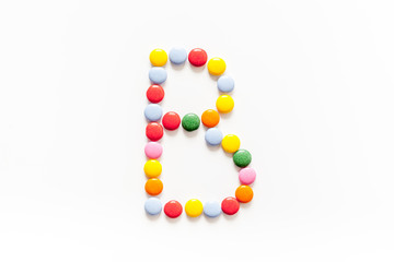 Candies font alphabet. Letter B isolated top view