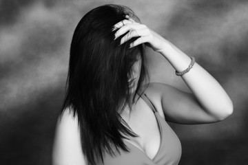 Beautiful, fancy glamourous caucasian girl with black hair posing in studio. Style, trends,...