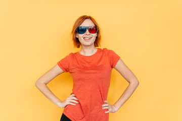 Young girl wearing 3d cinema glasses over isolated background