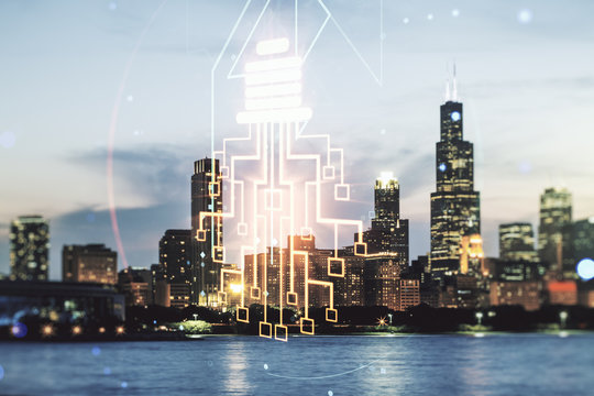 Double exposure of virtual creative light bulb hologram with chip on Chicago city skyscrapers background, idea and brainstorming concept © Pixels Hunter
