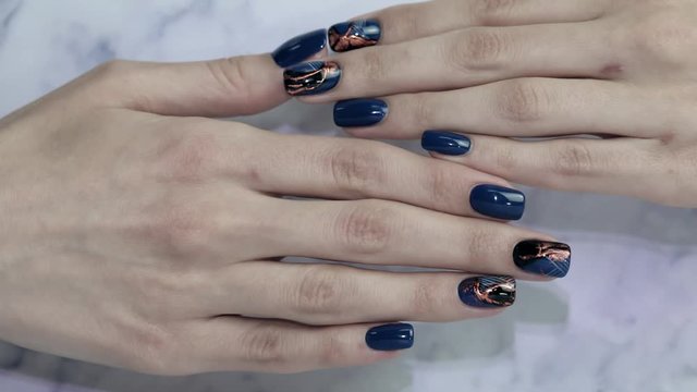 Female hands with beautiful nails. Stylish trendy female manicure. Beautiful young woman's hands