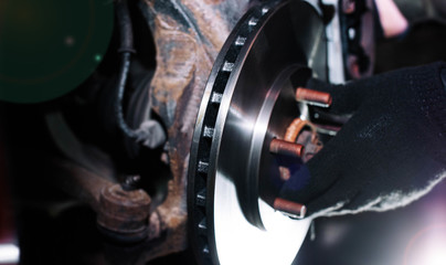 Fototapeta na wymiar replacement of brake disks of the car. brake system repair.