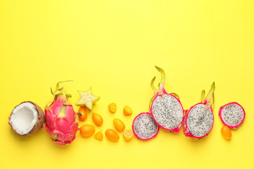 Tasty exotic fruits on color background