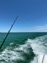 fishing rod on a boat in the emerald gulf of Mexico water 