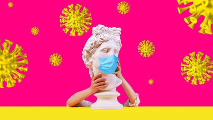 Gypsum statue of Apollo head. Creative. Plaster statue of Apollo head in medical mask. Woman hands .  On a pink background. Concept art collage.