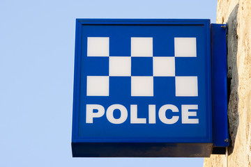 Police Station Blue and white generic checkered patterned sign