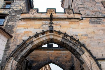 Amazing low angle shot of the gates of Charles bridge in Prague