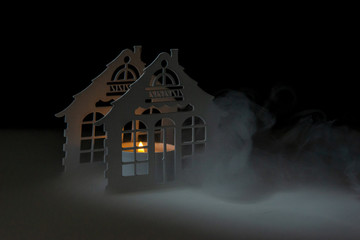 candlestick in smoke on a black background with candle
