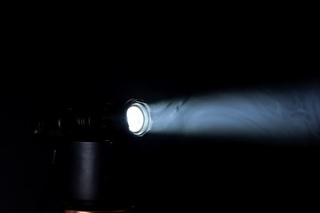 LED flashlight beam in smoke
