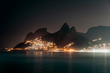 Night View of Mountains, Vidigal Slum and Leblon Beach With Lights, in Rio de Janeiro, Brazil