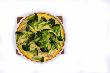 Baked Quiche with Broccoli, Onion, Meat and Bacon.