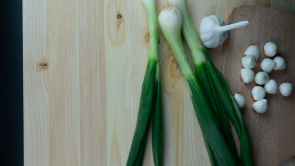 
Composition and preparation for a meal of spring onions and garlic