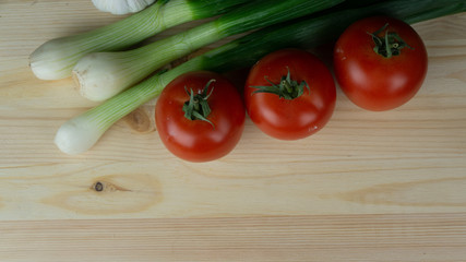 
Composition and preparation for a meal spring onions and tomato