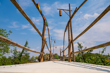 The wooden bridge with rice field at Phrathat San Don temple