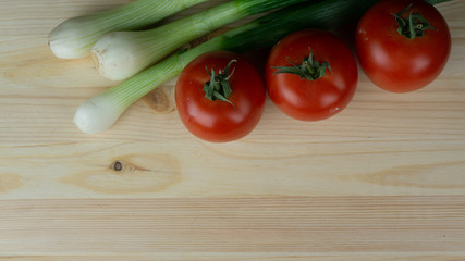
Composition and preparation for a meal spring onions and tomato