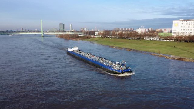 Aerial view of a barge boat navigating the Rhine River near Cologne, Germany