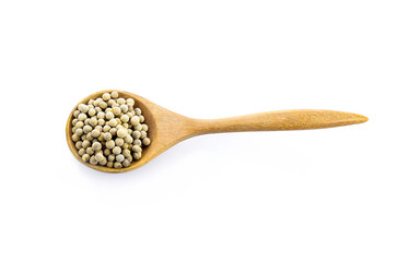 pepper corn in scoop  on white background