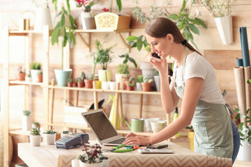 Female florist working in shop
