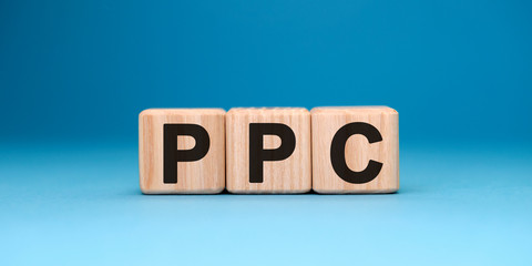 PPC website - text concept on wooden cubes with gradient blue background