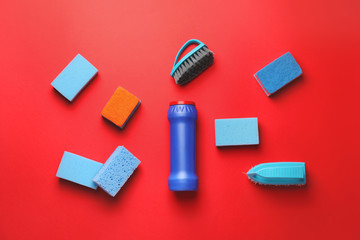 Set of cleaning supplies on color background