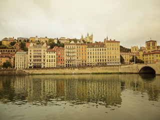 The Pont Bonaparte over the Saone river, the Basilica of Notre-Dame de Fourvièrel, Quai Fulchiron (quay), the Lyon Cathedral and the 5th Library St John Episcopal, France.