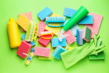 Set of cleaning supplies on color background